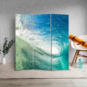 May include: A three-panel room divider featuring a vibrant ocean wave. The image captures the wave's curl, showcasing shades of blue and green. The artwork evokes a sense of the ocean's power and beauty, perfect for coastal decor.