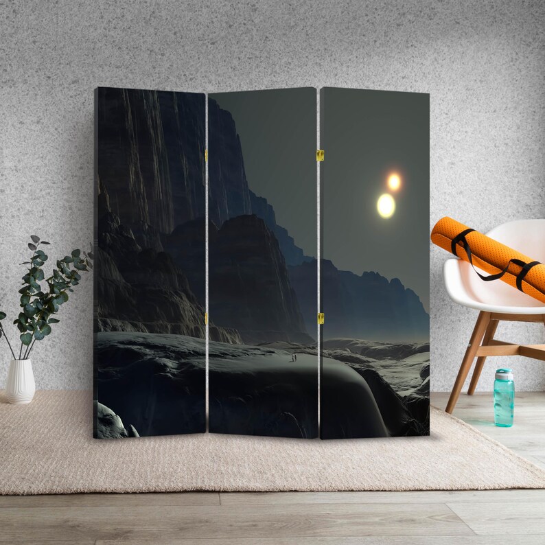 Dark sci fi landscape canvas room divider folding screen used as a privacy panel in a modern studio interior
