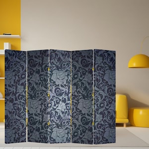 May include: A six-panel room divider with a dark blue floral pattern. The design features swirling vines and stylized flowers in shades of gray and blue. The divider has gold-colored hinges and stands on a white floor.