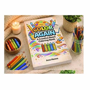 May include: A hardcover coloring book titled "Color Again" with colorful illustrations of crayons and pencils. A wooden bowl of crayons, a jar of colored pencils, and a lit candle are also visible.