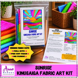 May include: A Sunrise Kinusaiga fabric art kit in a clear plastic bag with a colorful sun and landscape illustration, a wooden seam ripper, and an instruction sheet. A yellow starburst graphic displays text about kit options.