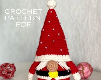 May include: A red and white crochet gnome with a pointed hat decorated with small white beads. The gnome features a white beard, a black belt with a yellow buckle, and white cuffs. The text "CROCHET PATTERN PDF" is visible.