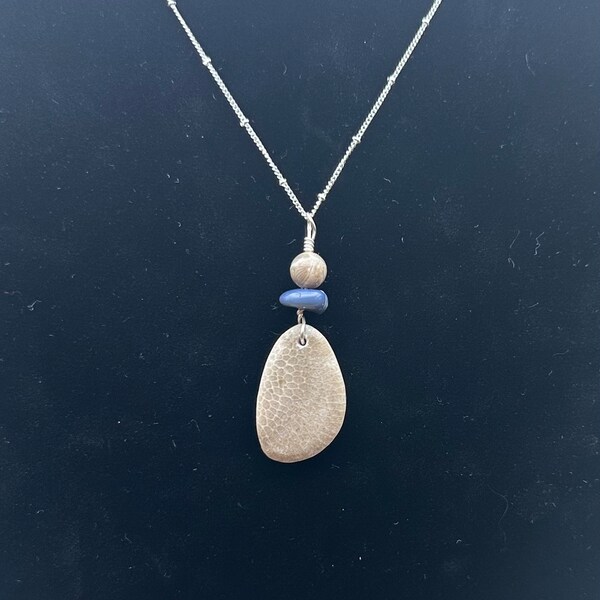 Bee Ware Custom Jewelry’s Lake Michigan Charlevoix Stone pendant, with Petoskey bead, and Leland Blue bead on a 30 inch chain. Necklace