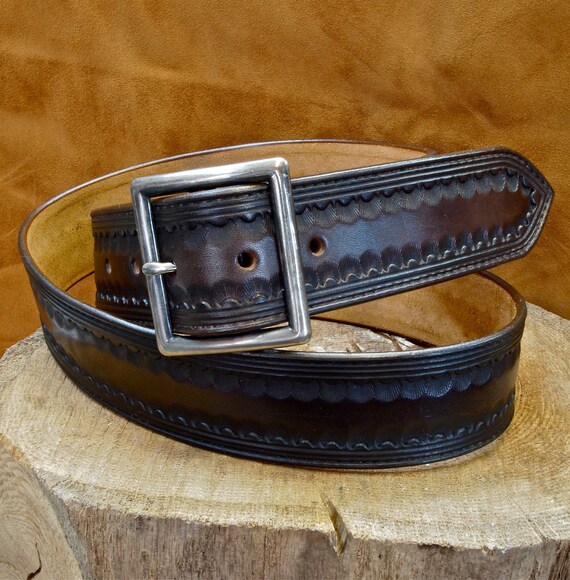 Brown leather belt : Hand Tooled Western border with Distressed buckle. Gun leather/ Cowboy style. Made in New York