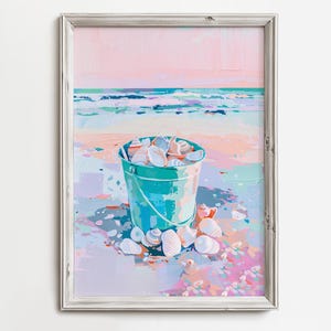 May include: A teal bucket filled with white seashells sits on a beach with a pink and blue sky in the background.