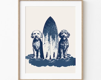 May include: A framed print featuring two dogs flanking a surfboard. The surfboard is navy blue with white paint splatter details. The dogs are depicted in a navy blue and white color scheme, sitting in what appears to be water. The background is a cream color.