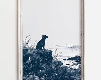 May include: A framed print of a black silhouette of a dog sitting on a rocky cliff overlooking a body of water. The print is in shades of blue and white.