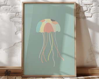 May include: A framed print of a colorful jellyfish with a light blue background. The jellyfish has a pink, yellow, and blue bell with long, flowing tentacles.