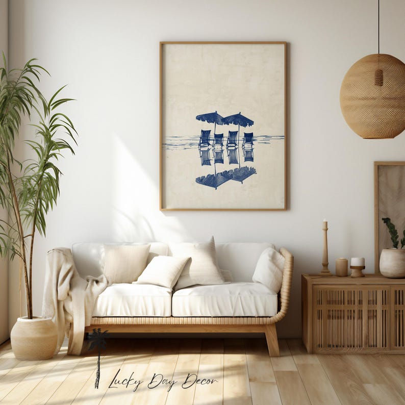 May include: A digital illustration of four blue beach chairs with umbrellas reflected in the water. The chairs and umbrellas are in a row and are facing the viewer. The background is a light beige color.