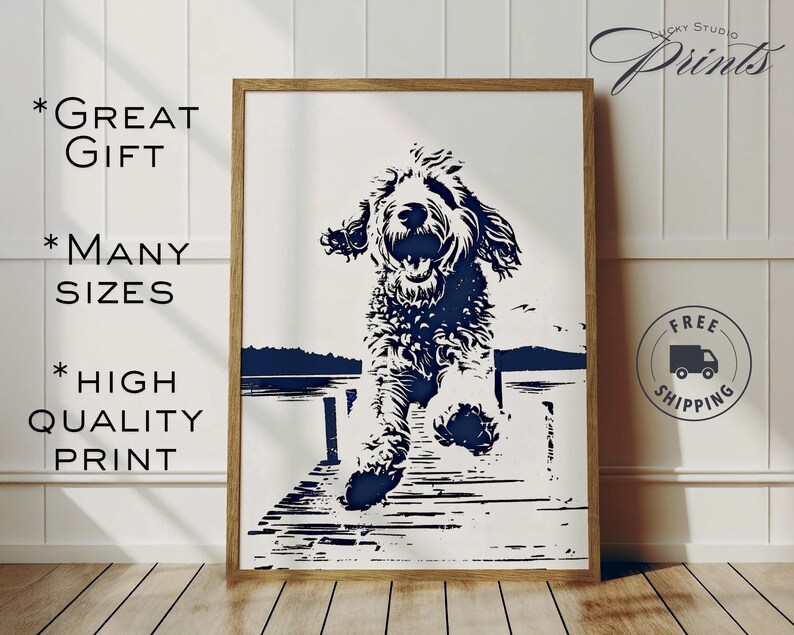 May include: A framed print featuring a black and white illustration of a dog leaping off a dock. The artwork has a minimalist style with a navy blue lake and sky background. Text on the print reads "GREAT GIFT", "MANY SIZES", and "HIGH QUALITY PRINT".