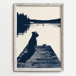 May include: A black and white silhouette of a dog sitting on a wooden dock overlooking a lake. The dog is looking out at the water, and the trees and mountains in the background are also silhouetted.