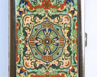 May include: A silver cigarette case with a colorful, intricate design featuring a central mandala-like pattern. The design is reminiscent of traditional Asian art and features a variety of colors, including red, green, blue, and gold.