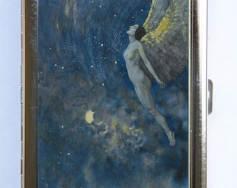 May include: A silver cigarette case with a colorful image of a winged woman flying through a starry night sky. The woman is nude and has long dark hair. The sky is a deep blue with white stars and a crescent moon.