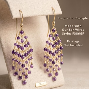 May include: Gold-tone chandelier earrings with amethyst beads. The earrings have a cascading design with multiple strands of purple beads. The text on the image says "Inspiration Example" and "Made with Our Ear Wires Style: F386GF. Earrings Not Included."