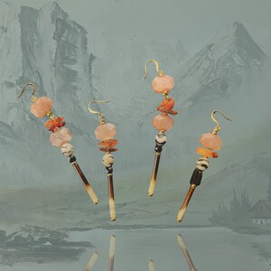 Porcupine quill dangle earrings with zebra agate, pink moonstone and copal bead detail, gold plated hook earrings.