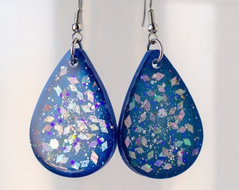 Bold blue resin teardrop dangle earrings with silver iridescent glitter sparkles