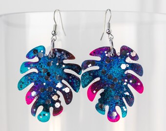 Cosmic galaxy colorful planetary space monstera leaf frond dangle sparkle earrings in resin