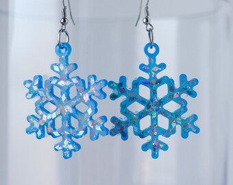 Festive glittery snowflake dangle earrings holiday bright blue