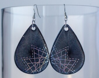 Large dangle liquid shimmer dark gray resin statement earrings with iridescent star patterns