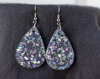 Clear resin teardrop dangle earrings with silver iridescent glitter sparkles