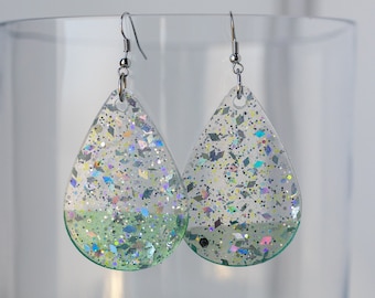 Large clear resin teardrop earrings with silver glitter and hand painted mint blue detail. One of a kind!