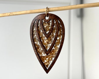Stained wood pendant with fold leaf in resin