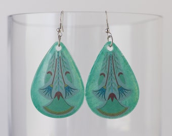 Large dangle liquid shimmer green resin statement earrings with indigenous-inspired pattern