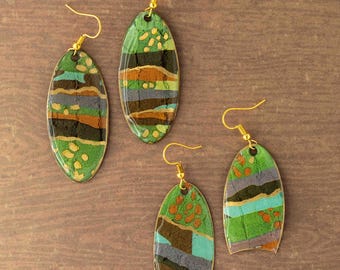 Long oval resin and paper earrings with green, blue, gold and earthy browns
