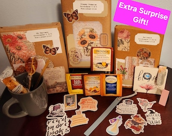 May include: An assortment of wrapped books, tea, stickers, and a mug. The books are adorned with floral and butterfly motifs. Tea packets include Twinings Earl Grey and Orange & Cinnamon Spice. Stickers say "Read More Books" and "Witchy & Wild."