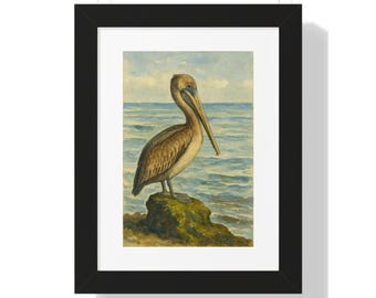 May include: Framed watercolor print of a brown pelican standing on a mossy rock, set against a backdrop of the ocean and sky. The pelican has a long beak and is facing to the right. The artwork is in a black frame.