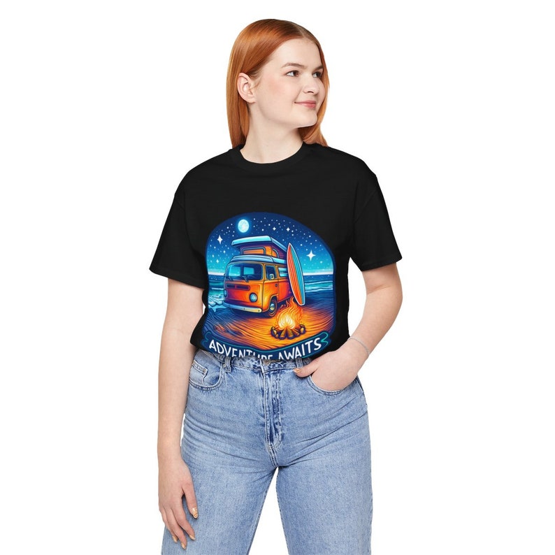 Women wearing Adventure Awaits Camping T-Shirt, Perfect Gift for campers and digital nomads, Unisex Organic Soft Graphic T-Shirt, Fun and Chic T-Shirt in Black