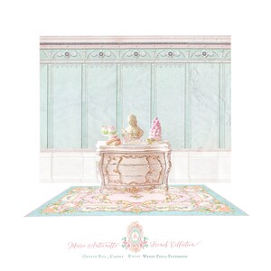 May include: A miniature chest of drawers in a distressed cream finish with gold accents, topped with a small bust, pastries, and a macaron tower. Below sits a rectangular rug featuring a pink floral pattern on a light blue border.