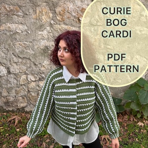 May include: A green and white striped crochet cardigan. The long-sleeved sweater has a button-up front and is worn over a white collared shirt. The image also includes the text "CURIE BOG CARDI PDF PATTERN".