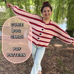 May include: A hand-crocheted cardigan with red, white, and peach stripes. It features a round neck and three black buttons. The text "CURIE BOG CARDI PDF PATTERN" is visible on the left side of the image.