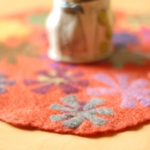 orange pin wheel round table runner