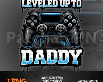 May include: Black and blue graphic design featuring a video game controller with the text "LEVELED UP TO DADDY." The design includes dripping paint effects and is a high-resolution digital download.