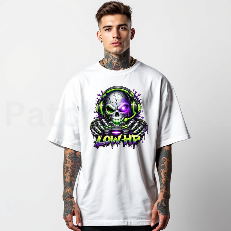 May include: White t-shirt featuring a skull graphic wearing headphones and holding a game controller. The skull has a purple eye and green accents. The text "LOW HP" is below the skull in green and purple.