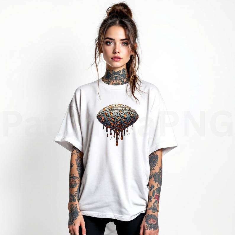 K&ouml;nnte beinhalten: Wei&szlig;es T-Shirt mit einem farbenfrohen, abstrakten Design einer ovalen Form mit rissiger Textur und tropfenden Elementen. Das Design enth&auml;lt Farbt&ouml;ne von Blau, Orange und Braun. Das Shirt hat kurze &Auml;rmel und eine lockere Passform.