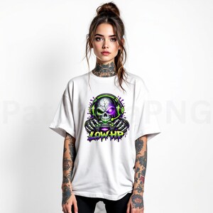 May include: White t-shirt featuring a skull wearing a headset and holding a game controller. The skull has a purple eye and green accents. The text "LOW HP" is below the skull in purple and green.