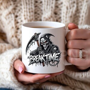 May include: White ceramic mug with a grim reaper design, holding a scythe, and the words "BREAK TIME". The grim reaper has red eyes and wears a black hooded cloak. The mug is held by a person. The design is in black and grey.