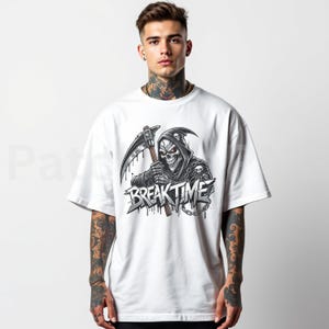 May include: White t-shirt with a black and grey graphic of a grim reaper holding a scythe, with the words "BREAK TIME" in a stylized font. The design includes dripping effects and skull details.