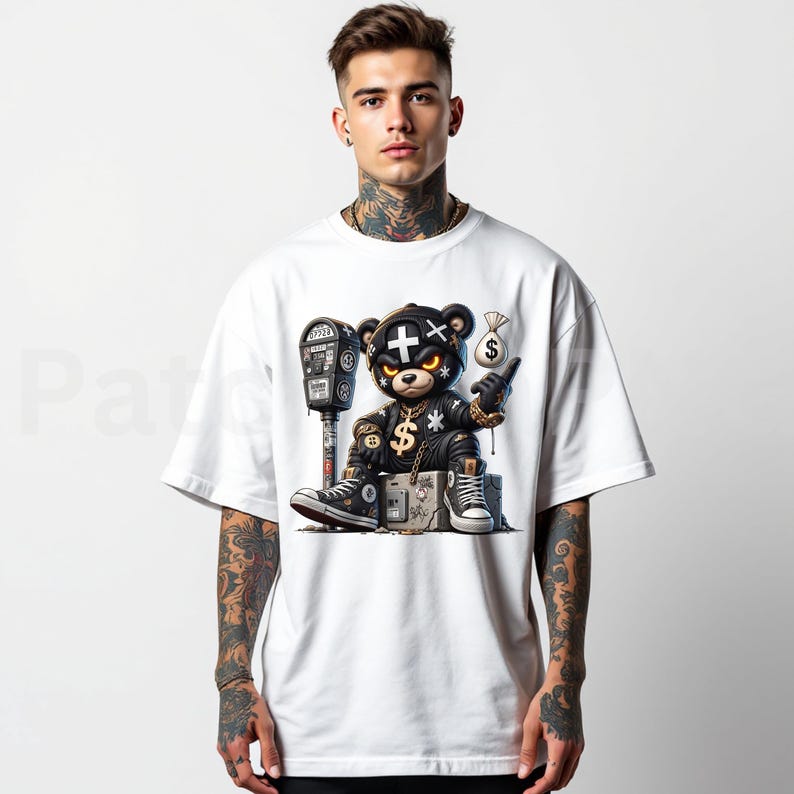 May include: White t-shirt featuring a cartoon bear with a cross on its head, wearing a black leather jacket, gold chain, and holding a money bag. The bear is sitting next to a parking meter. The bear is wearing black and white sneakers.