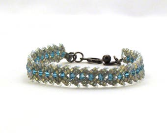 Light Aqua Blue in Golden Grey feather bracelet