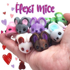 Mouse flexível com cauda em formato de coração – um brinquedo antiestresse adorável ou item de colecionador. imagem 2