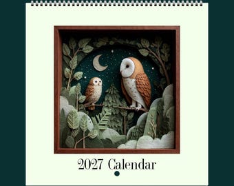 May include: A 2027 wall calendar measuring 21 cm by 21 cm featuring a square illustration of two owls perched in a forest at night under a crescent moon. The artwork is framed in a dark wood border with layered green foliage and trees.