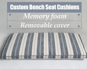 May include: Custom bench seat cushion with a striped fabric cover in shades of gray and white. The cushion is made with memory foam and has a removable cover.