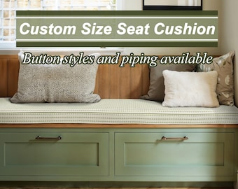 May include: A custom size seat cushion with button styles and piping available. The cushion is white with a subtle pattern and is placed on a bench with green cabinets underneath.