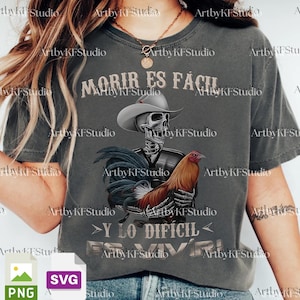May include: Dark gray t-shirt featuring a skeleton wearing a cowboy hat and holding a rooster. The shirt has the text "MORIR ES FÁCIL Y LO DIFÍCIL ES VIVIR" printed on it.