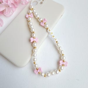 Custom pink bow pearl phone charm, personalised beaded name phone strap, wrist camera strap holder, cute cell phone accessory