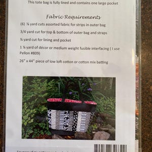 May include: A close-up of a pattern for a tote bag. The pattern includes instructions for fabric requirements, finished size, and a list of materials needed. The image also shows a finished tote bag with black, white, and red fabric.